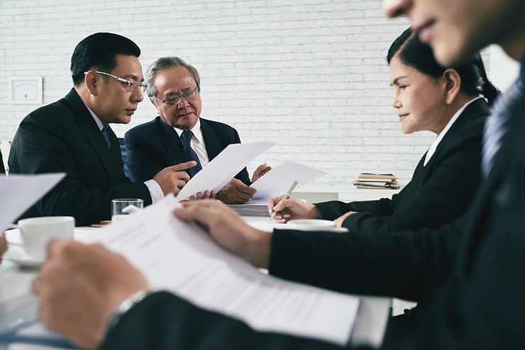 Eye-level view of a professional team discussing branding strategy in a modern office