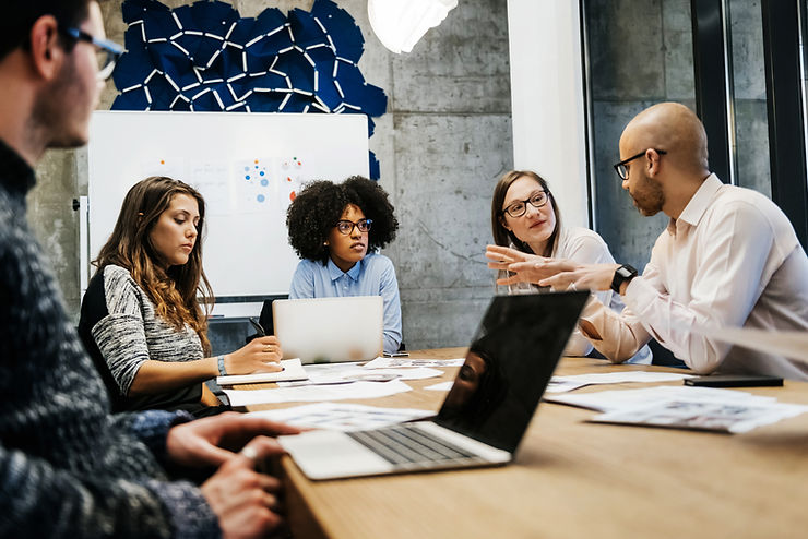 High angle view of a marketing team analyzing branding campaign results